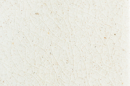 background and texture of stretch marks cracked on white cream glazed tile