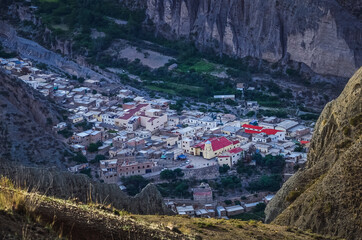 Stock photo of the Iruya village between colored hills and mountains valley. Salta, Argentina....