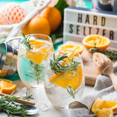 Hard seltzer cocktail with orange and zero waste bartenders accessories