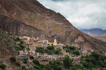 Stock photo of the Iruya village between colored hills and mountains valley. Salta, Argentina....
