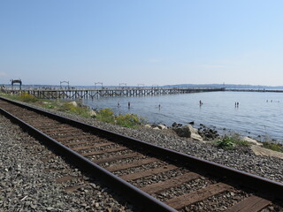 the view of the pier from the train tracks in White Rock, British Columbia, Canada, August