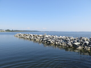 a stone wall close to the white rock in White Rock, British Columbia, Canada, August