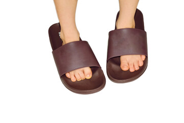 child - the boy puts on daddy's flip flops, large, not in size