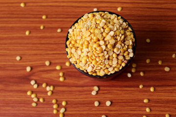 split pigeon peas ( Arhar Dal ) Organic Toor Dal in Bowl, Selective Focus with Blur Background