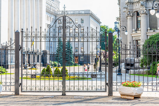 Kyiv, Ukraine Ukrainian parliament building Verhovna Rada with closed gate for security in Kiev and people in bokeh background