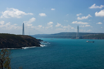 Views of the Bosphorus and bridges in the city of Istanbul. Turquoise sea water and bright sun.