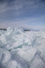 Fototapeta na wymiar Blue Ice in the Straits of Mackinac in Mackinaw City, Michigan