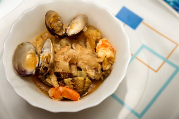 cocktail bowl with clams and prawns in sauce . seafood