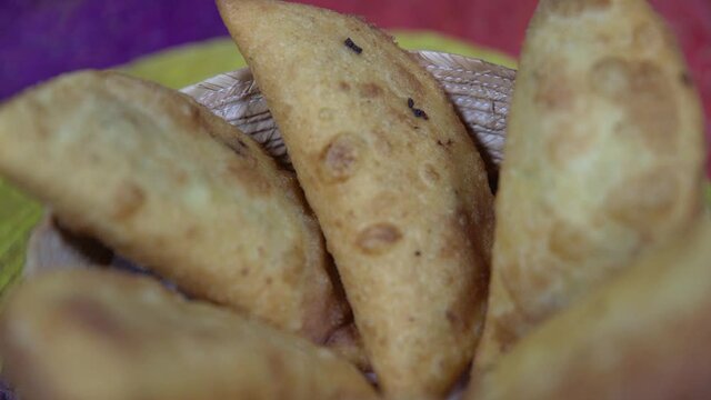 Plate of empanadas, turnover consisting of pastry and filling. Close up