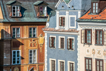 Warsaw, Poland rynek old town market square with historic architecture of wall corner with windows closeup pattern of blue and brown colors