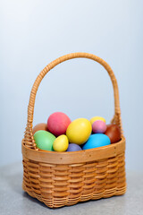 a basket full of colorful colored eggs for the Easter holiday