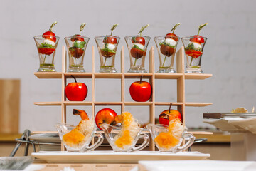 Canapes on toothpicks, appetizer, pinchos, spanish food. Quail eggs and cherry tomatoes.