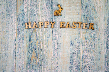 The Easter bunny. Holy Easter. Blue turquoise background. Happy Easter
