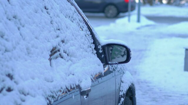 Car covered with snow in 4k slow motion 60fps