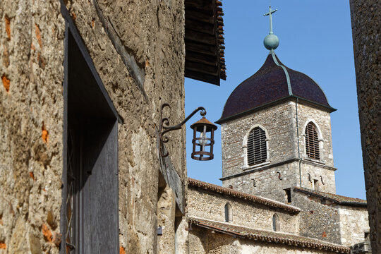 PEROUGES, FRANCE, February 23, 2021 : The bell tower of the old city. The town was restored and houses were saved in the beginning of 20th century and is now a popular tourist attraction.