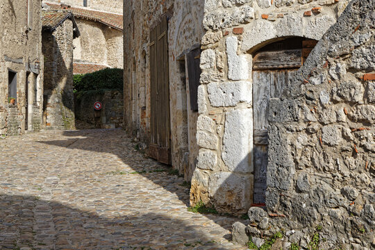 PEROUGES, FRANCE, February 23, 2021 : A street of the old medieval town. The town was restored and houses were saved in the beginning of 20th century and is now a popular tourist attraction.
