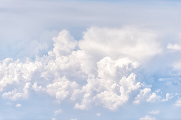 Above high angle view of sky cloudscape with fluffy clouds and bright soft sunny sunlight aerial view of Europe from airplane