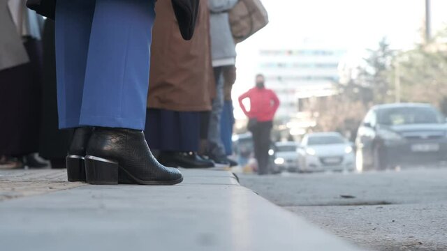 close up of passengers waiting for bus in bus stop in Istanbul and cars moving on the road 4K high resolution