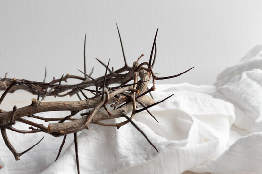 Crown of thorns on white linen with copy space - Powered by Adobe