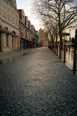 empty street at evening in La rochelle, France. Saint Nicolas Tower in the background