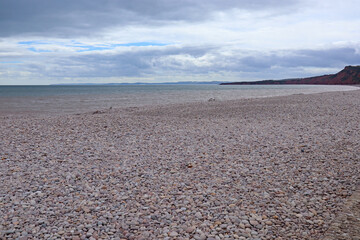 The empty pebbly beach at Budleigh Salterton in Devon, England