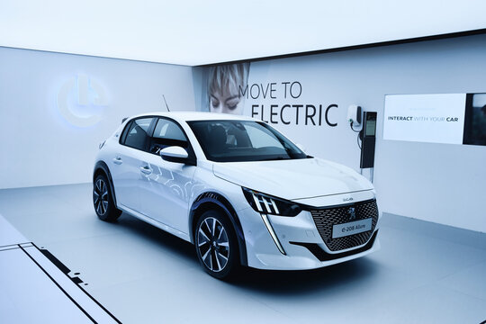 Peugeot 208 electric white clean showroom at the geneva international motorshow, ev car from stellantis group, GENEVA, SWITZERLAND - MARCH 6, 2019