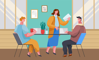 Business people dressed in casual clothes sitting at the table with computers and documents talking, communicating. Office meeting and consideration of working moments. Businessperson in workspace