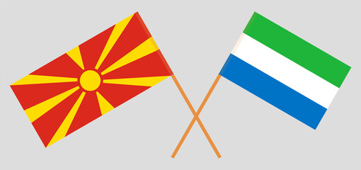 Crossed flags of North Macedonia and Sierra Leone. Official colors. Correct proportion