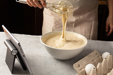 Culinary master class. Woman searching information on internet.