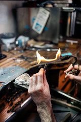 Hands of an artisan Making Handmade Jewelry