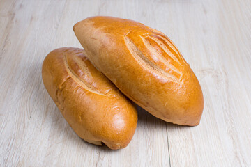 Fresh bakery on light wooden background
