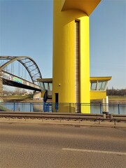 A yellow raisable bridge in the harbour
