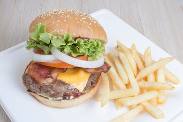 Traditional hamburger of beef, tomato, lettuce, onion and cheese