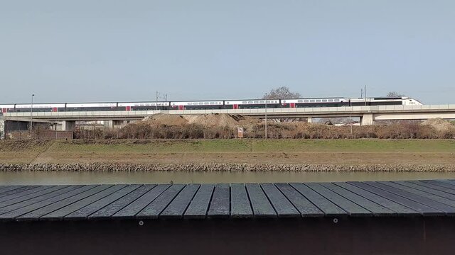 Train passing by on a bridge
