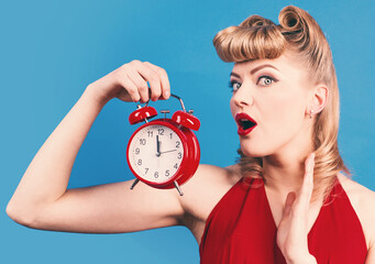 Time. Surprised woman with alarm watch. Pin up girl with alarm clock.