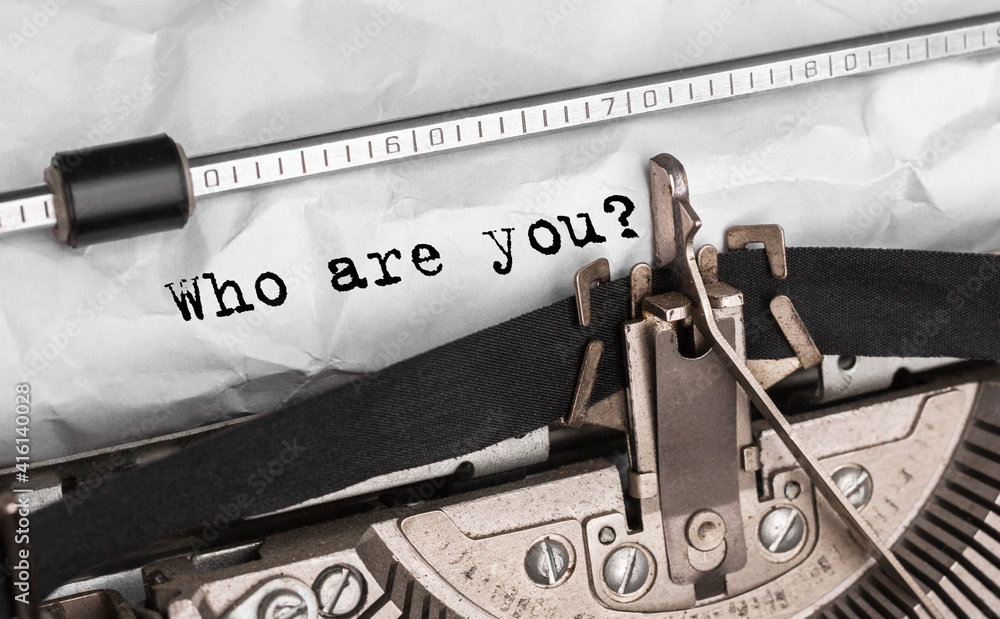 Poster text who are you typed on retro typewriter