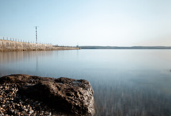 Long exposure seascape in Weymouth in the morning. Stone in foreground.