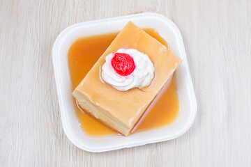 Colorful colorful desserts, made from tropical fruits on wooden background