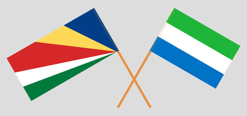 Crossed flags of Seychelles and Sierra Leone. Official colors. Correct proportion