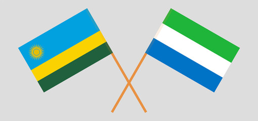 Crossed flags of Rwanda and Sierra Leone. Official colors. Correct proportion