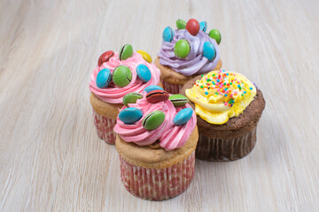Colorful colorful desserts, made from tropical fruits on wooden background