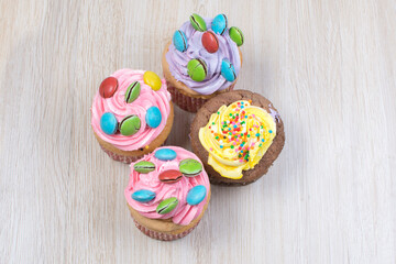 Colorful colorful desserts, made from tropical fruits on wooden background