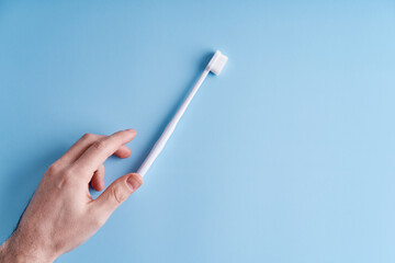 Fashionable toothbrush with soft bristles. Popular toothbrush. Hygiene trends