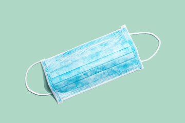 Blue surgical mask overhead view - flat lay