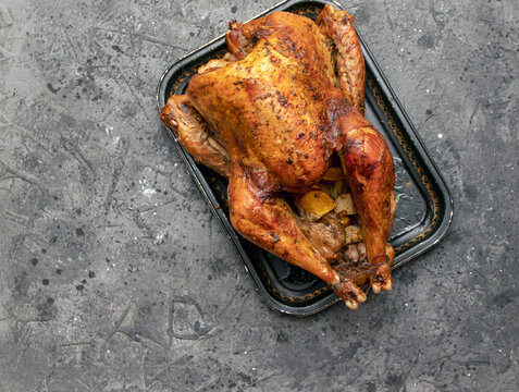 Homemade Roast Turkey, Lemon Close-up On A Slate Board On The Table. Horizontal Top View From Above