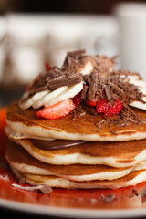 a stack of pancakes with jam
