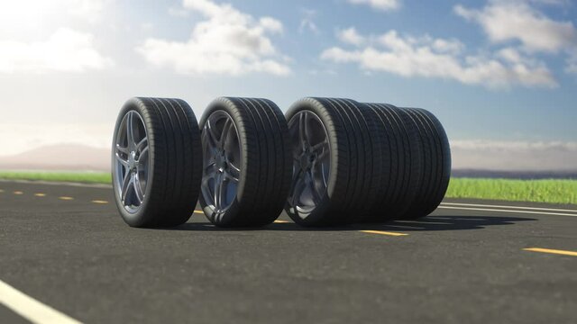 Loop car tires rolling on asphalt in the summer