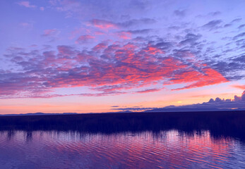 Fototapeta premium Sunset red sky over Titicaca lake, evening in Peru. silence, tranquility, serenity, relax, zen, meditation.