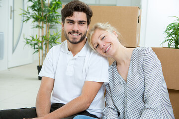 young couple posing with their boxes