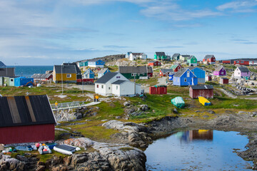 Greenland. Itilleq. Tourists walking though town. - obrazy, fototapety, plakaty